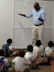 Principal Neil Phillips talks with students at the new all-boys charter school, Visible Men Academy.