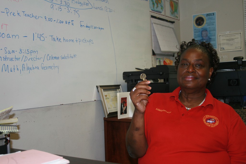 Kat Crowell-Grate holds the key to a new building recently donated for her school. "There's not been one time we haven't met our needs,'' she said.