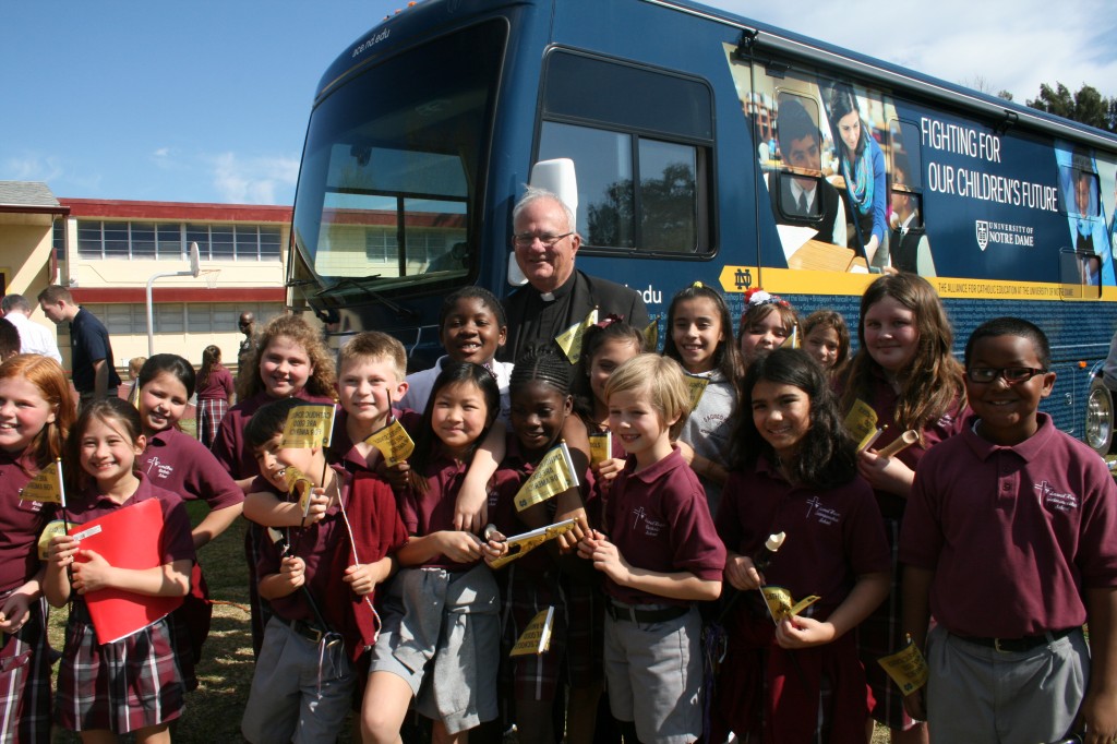 Bishop Robert Lynch of the Diocese of St. Petersburg helps celebrate the growth of Sacred Heart Catholic School in Florida, and other Catholic schools across the state during the University of Notre Dame's Alliance for Catholic Education bus tour.