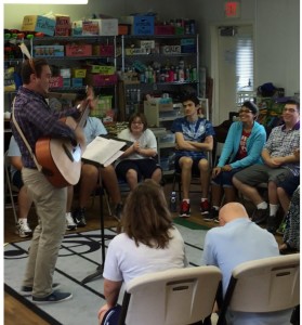 Ciaran Sontag leads students in a rendition of "Jingle Bell Rock."