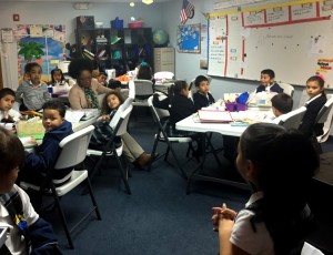 Jameka Fladger, a second-grade teacher at IEC Academy, reads to her students.