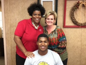 Deanna Joyner, her son Deondre Pride, and Victory Christian Academy headmaster Karla Collins